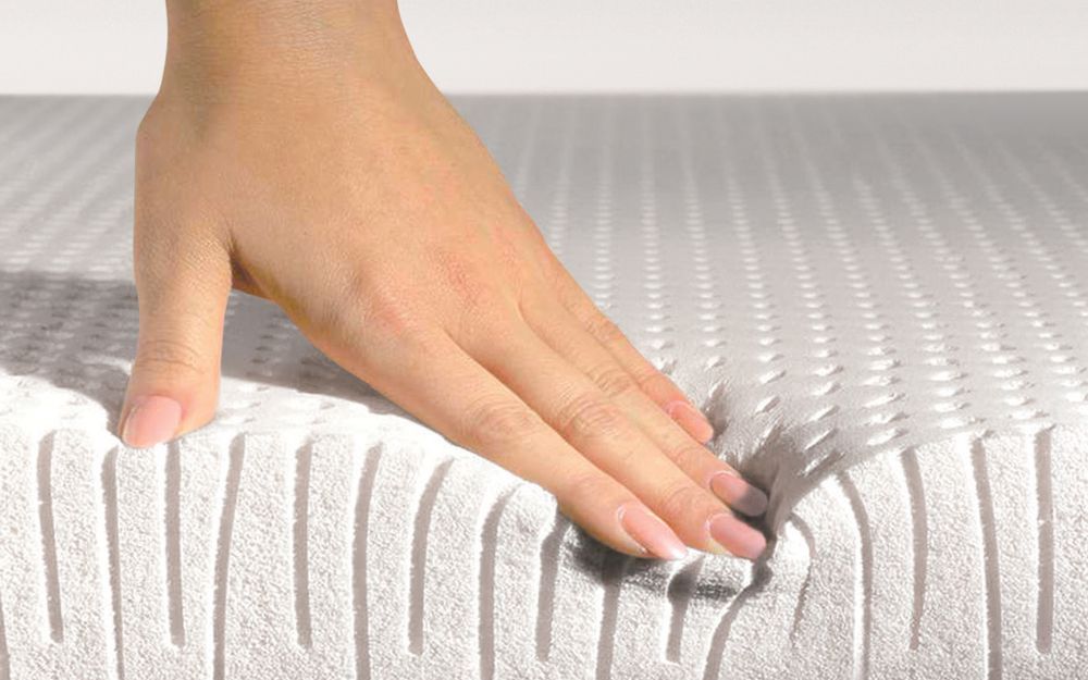 hand on latex mattress